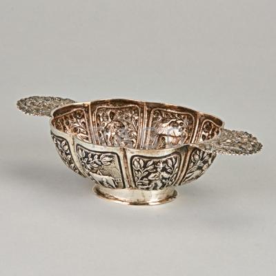 Appraisal: DUTCH SILVER HANDLED DRINKING BOWL - Lobed oval repousse cuelle