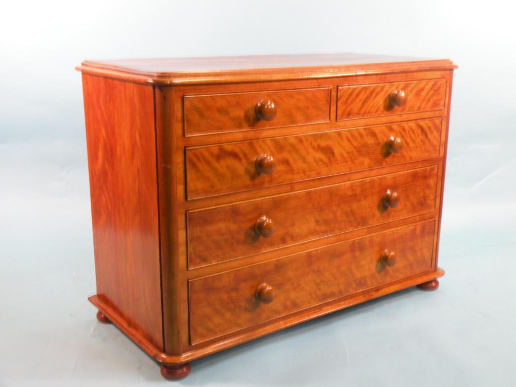 Appraisal: A Victorian satin walnut chest of two short and three