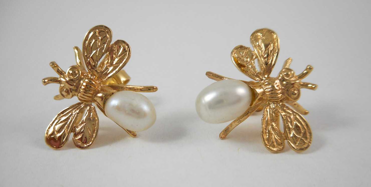 Appraisal: PAIR OF PEARL AND FOURTEEN KARAT GOLD EARRINGS each yellow