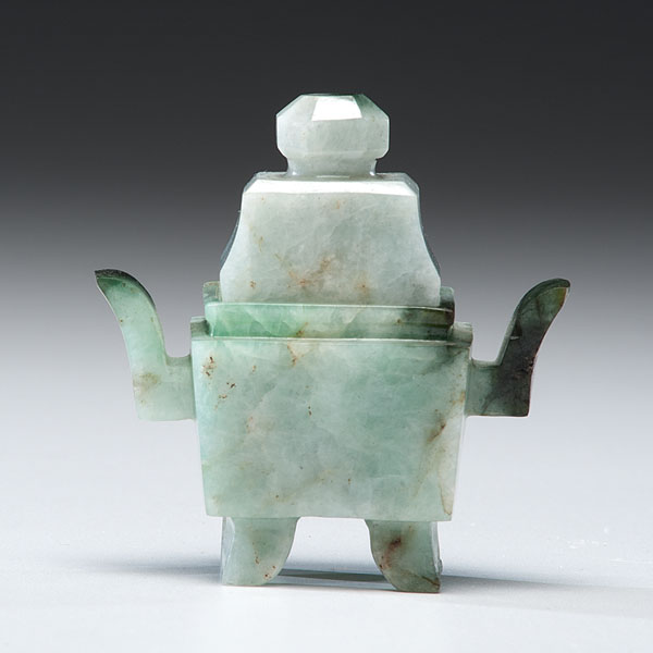 Appraisal: Chinese early th century A finely polished and carved jadeite