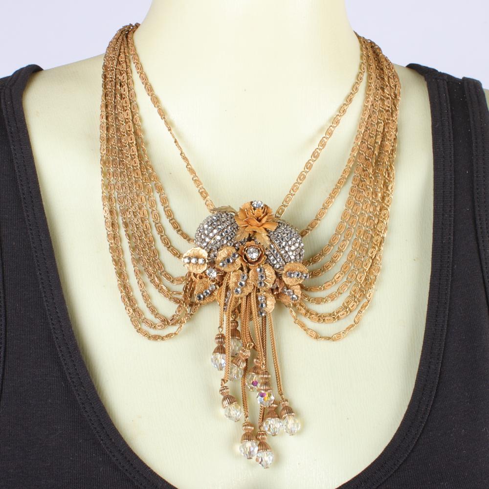 Appraisal: WILLIAM DELILLO -STRAND FESTOON NECKLACE WITH LAYERED RHINESTONE FLORAL PENDANT