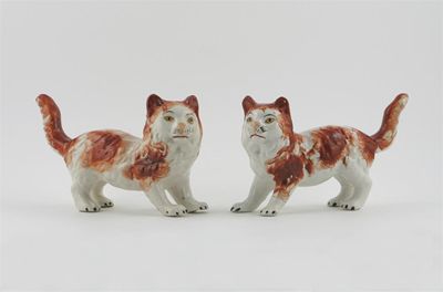 Appraisal: An unusual pair of Staffordshire cats standing four square with