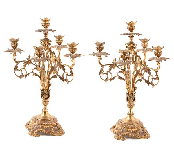 Appraisal: A pair of Rococo style five light brass candelabra height