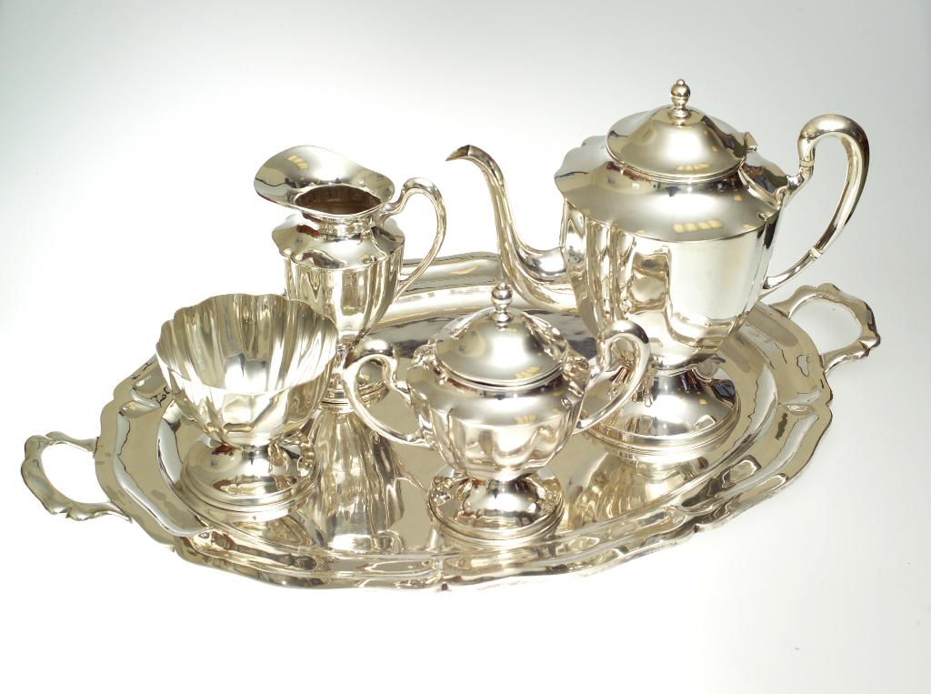 Appraisal: MEXICAN STERLING SILVER FOUR-PIECE TEA SERVICE AND TRAY comprising teapot