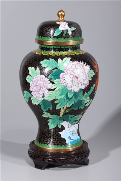 Appraisal: Chinese black-ground enameled covered vase with floral designs and wood