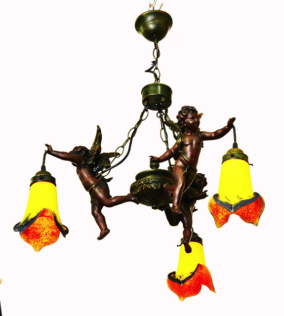 Appraisal: A HANGING CEILING LIGHT with chains supporting three winged flying