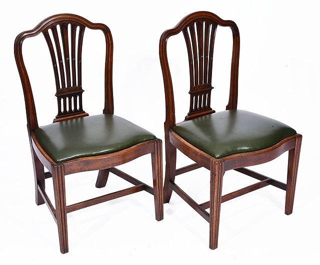 Appraisal: A PAIR OF GEORGE III MAHOGANY DINING CHAIRS with splat