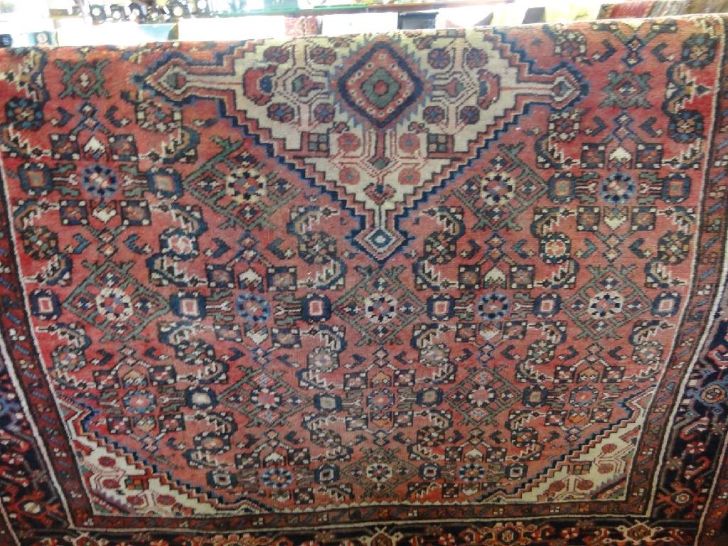 Appraisal: A Middle Eastern rug with a central medallion with a