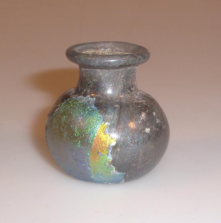 Appraisal: A small Roman ointment jar made in bluish-green glass the