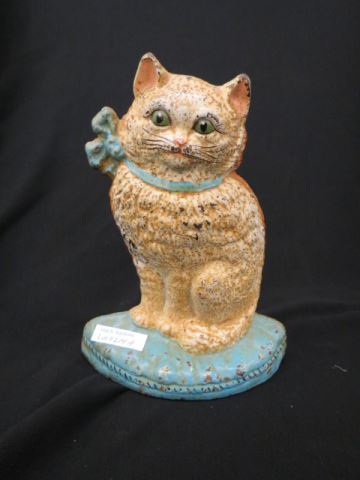 Appraisal: Cast Iron Figural Cat Doorstop white cat with blue bow