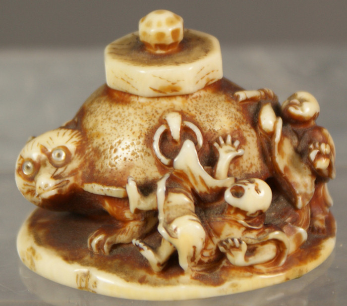 Appraisal: Netsuke Japanese ivory carving of figures attacking a badger w