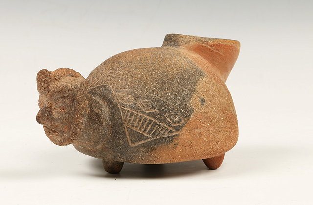 Appraisal: A MEXICAN VESSEL with round spout at back and bearded