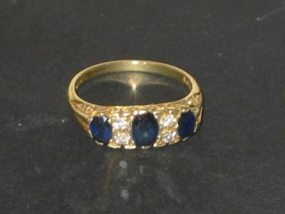 Appraisal: A SAPPHIRE AND DIAMOND RING comprising three oval sapphires set