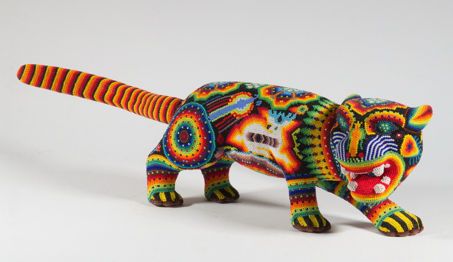 Appraisal: MEXICAN HUICHOL BEADED JAGUAR SCULPTURE Handcrafted Beaded Wooden Figure of