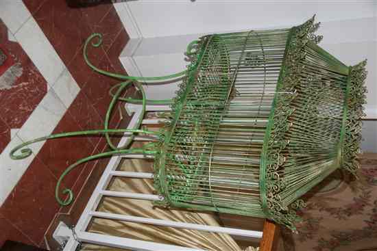 Appraisal: VICTORIAN GREEN-PAINTED BIRDCAGE th century Wire cage on conforming stand