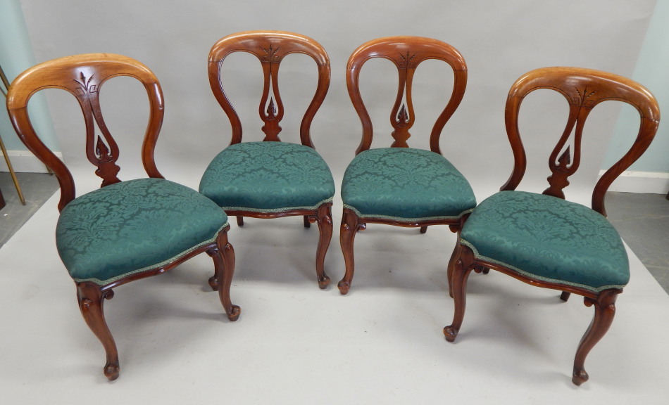 Appraisal: A set of four Victorian mahogany balloon back chairs each