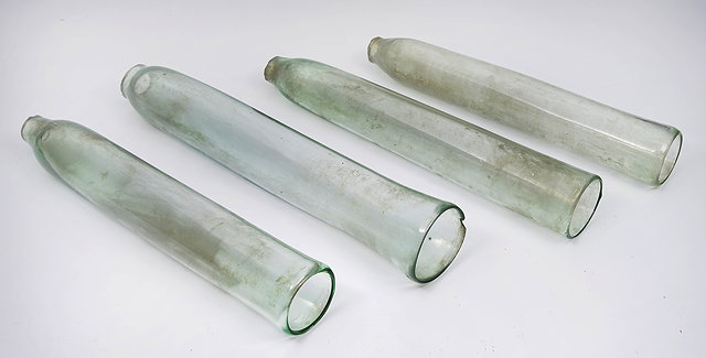 Appraisal: A GROUP OF FOUR VICTORIAN GLASS CUCUMBER STRAIGHTENERS of cylindrical