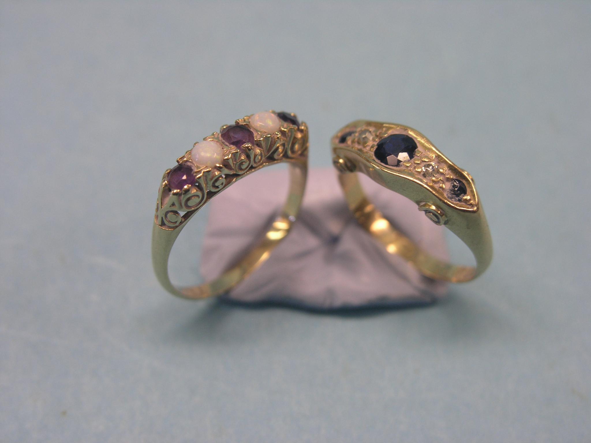 Appraisal: A gold half-hoop ring set three sapphires and diamond chips