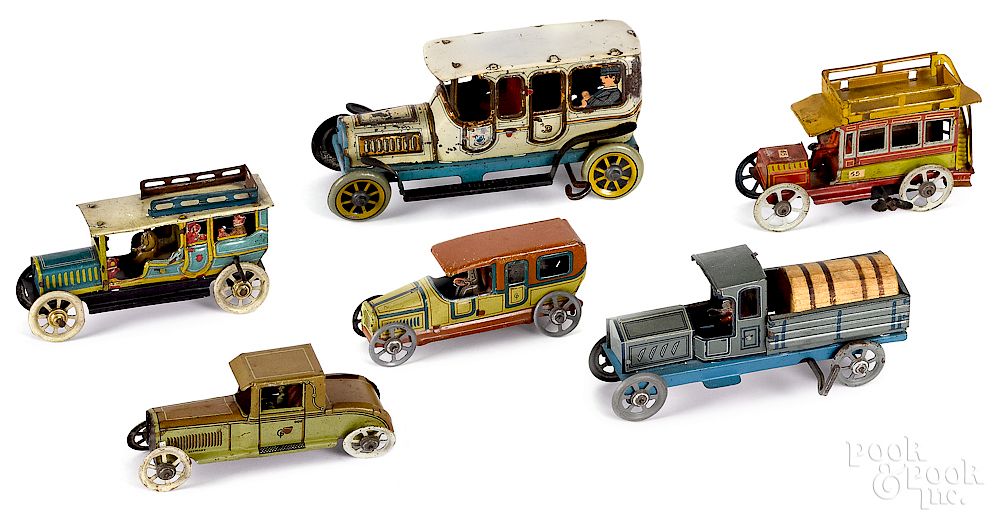 Appraisal: Six tin lithograph penny and nickel toy vehicles Six tin