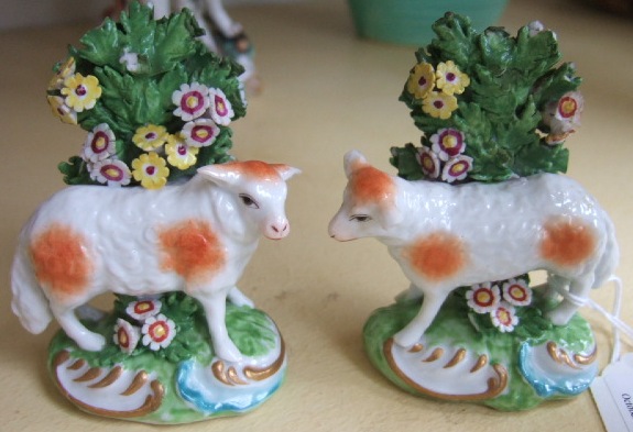 Appraisal: A pair of Staffordshire style figures modelled as sheep with