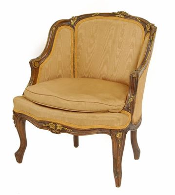 Appraisal: A carved walnut and parcel gilt low armchair upholstered ochre