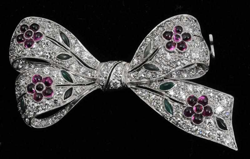 Appraisal: ART DECO PLATINUM DIAMOND AND RUBY BOW BROOCH Set with