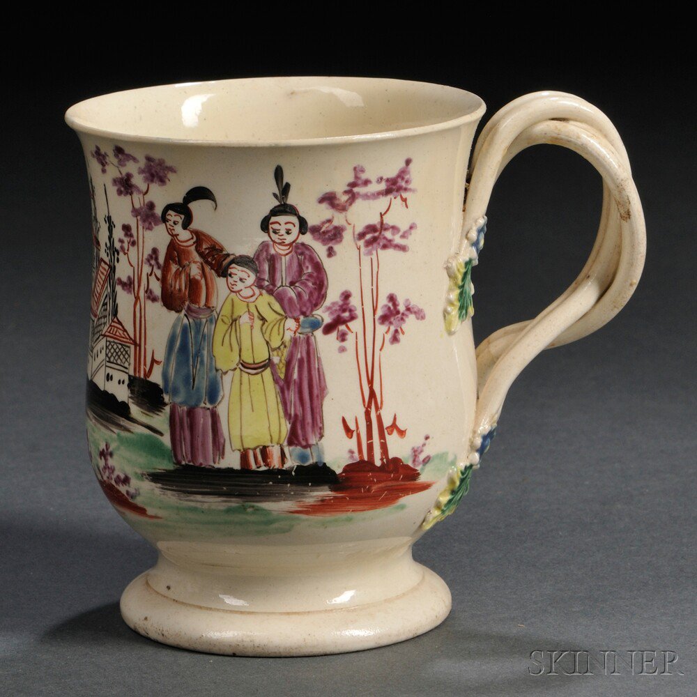 Appraisal: Staffordshire Cream-colored Earthenware Mug England c entwined strap handle polychrome