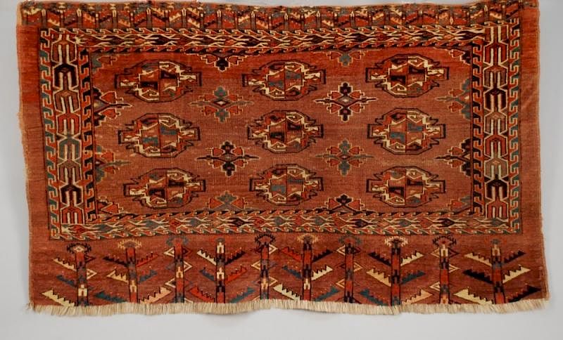 Appraisal: TURKMEN CARPET EARLY th C Aubergine palette in nine gul