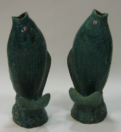 Appraisal: PAIR OF CHINESE GREEN GLAZED POTTERY VASES modeled in an