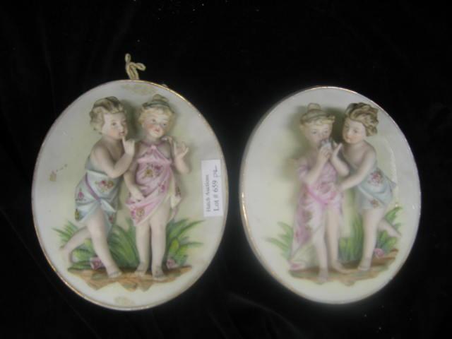 Appraisal: Pair of Figural Bisque Wall Plaques with children