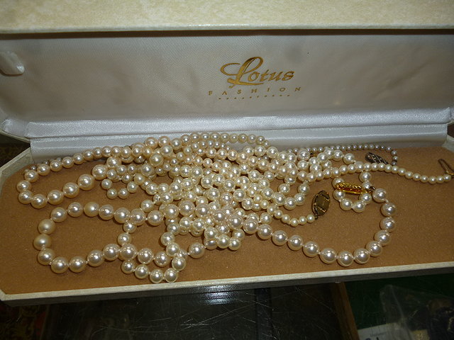 Appraisal: A GRADUATED PEARL NECKLACE long together with three faux pearl