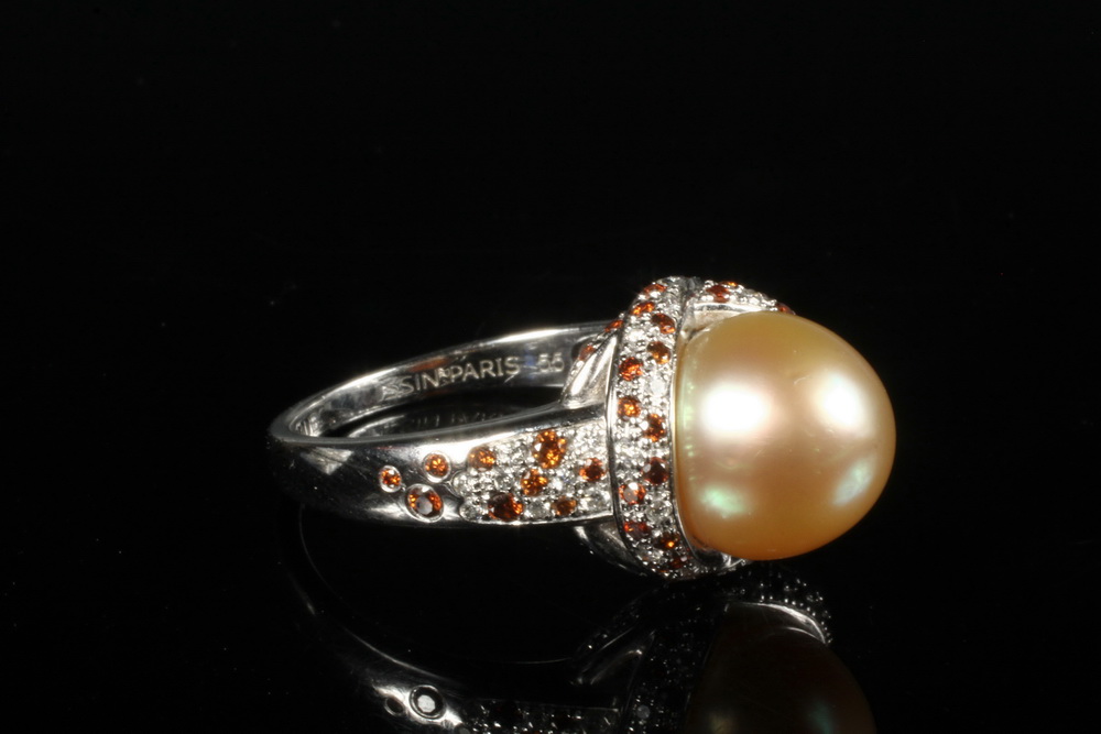 Appraisal: LADY'S RING - One K White Gold Golden Pearl Diamond