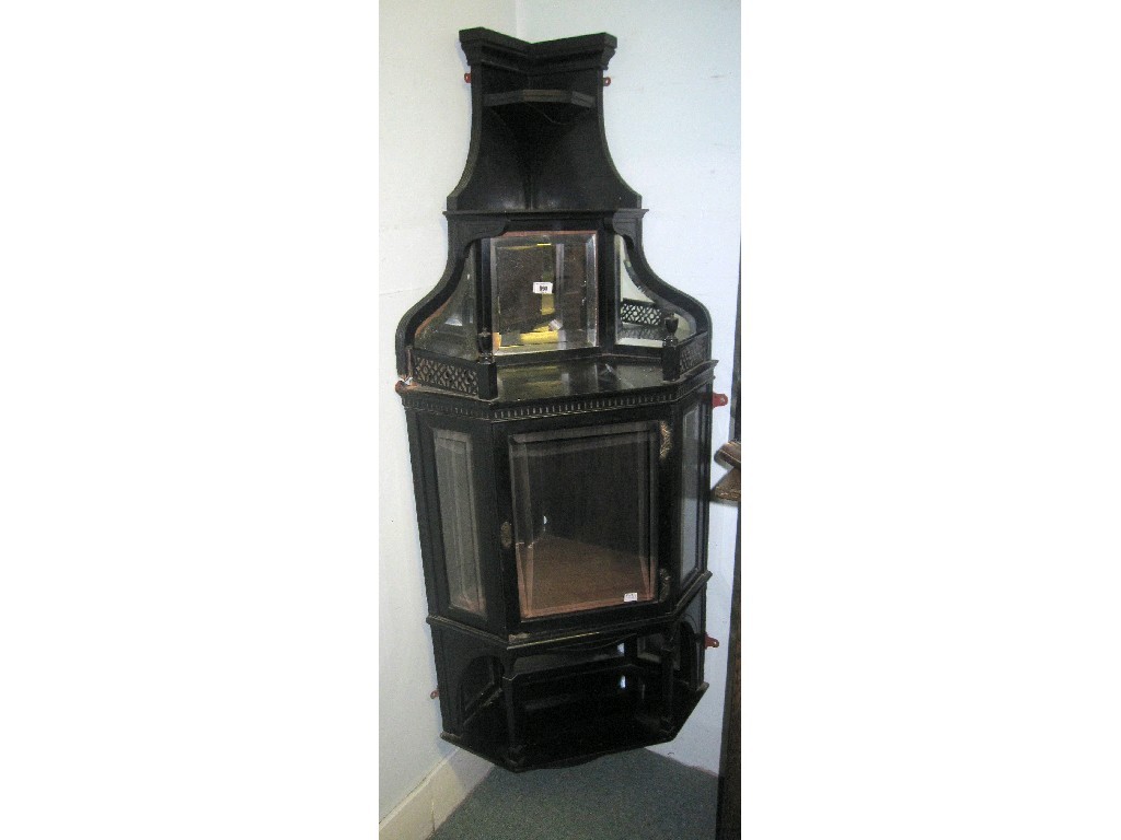 Appraisal: Ebonised mirrorback hanging corner cabinet