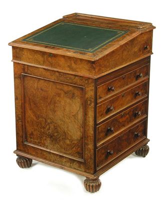 Appraisal: A William IV burr walnut Davenport the sliding top with