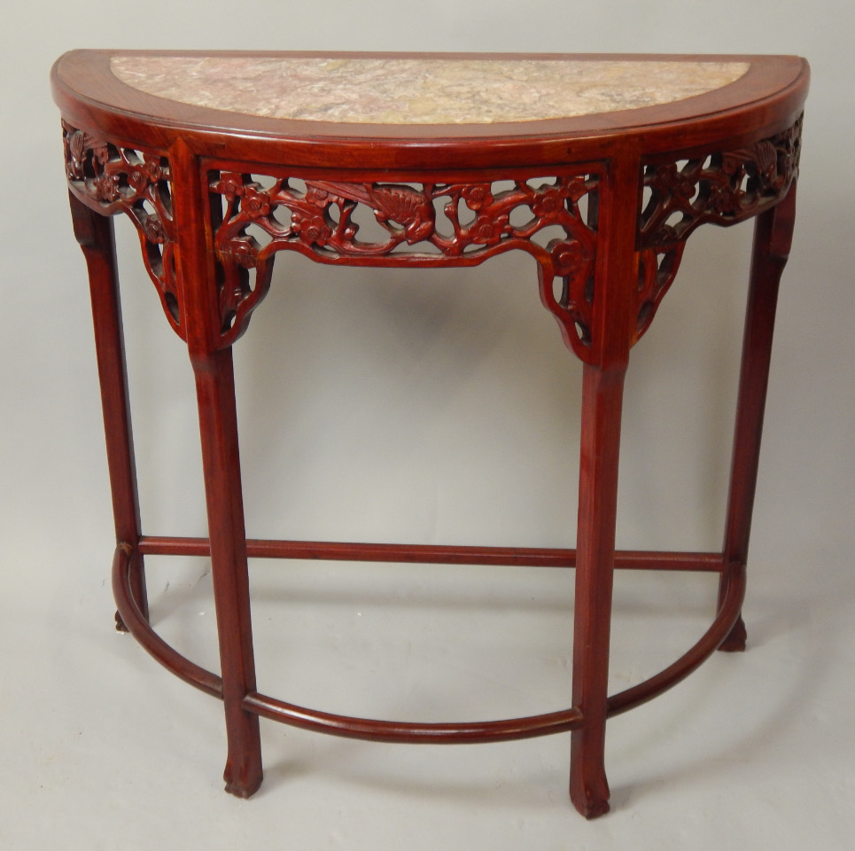 Appraisal: A Chinese rosewood demi lune table with grey and liver