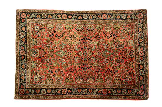 Appraisal: ORIENTAL RUG Sarouk Floral design with dark blue border and