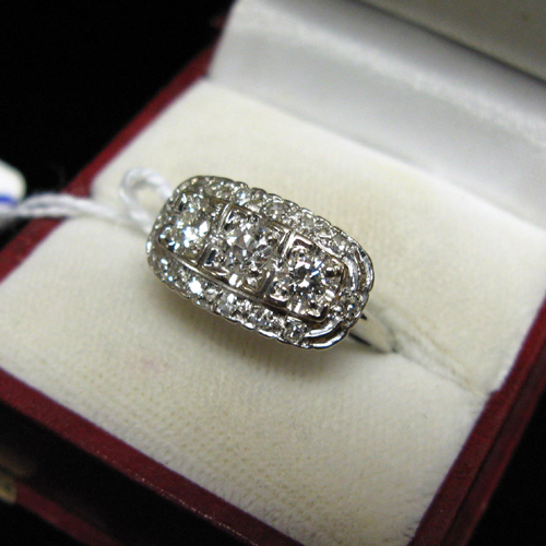 Appraisal: DIAMOND AND FOURTEEN KARAT WHITE GOLD RING having an elliptical