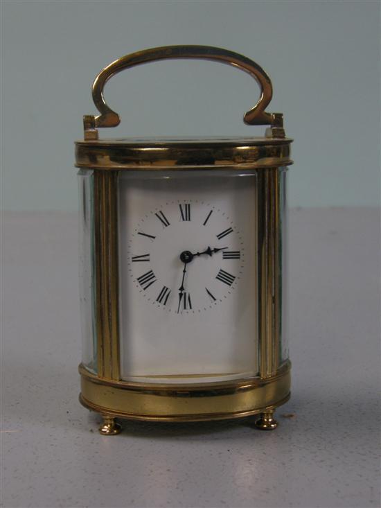 Appraisal: French brass oval carriage clock with eight day lever movement