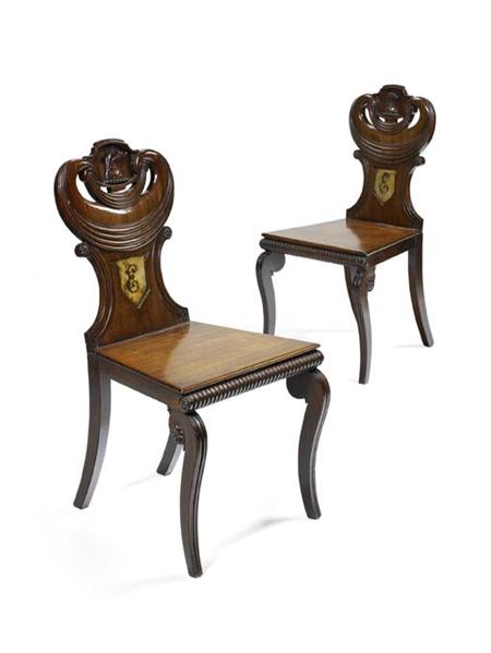 Appraisal: A pair of George IV mahogany hall chairs the reeded