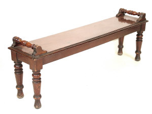 Appraisal: A Victorian mahogany hall bench of rectangular form with turned