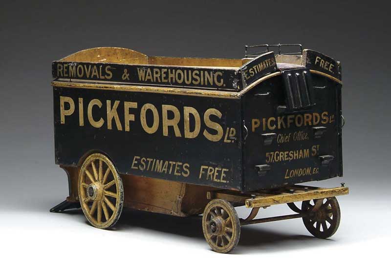 Appraisal: FOLK ART PAINTED MOVING WAGON The fine wood moving wagon