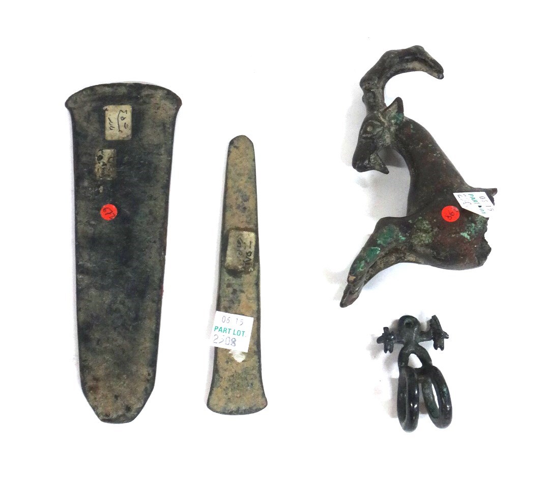 Appraisal: A group of Luristan bronzes including a stag finial a