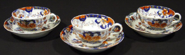 Appraisal: Three th Century china cups and saucers hand coloured and