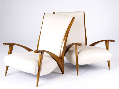 Appraisal: BRAZILIAN Pair of walnut lounge chairs covered in off-white silk