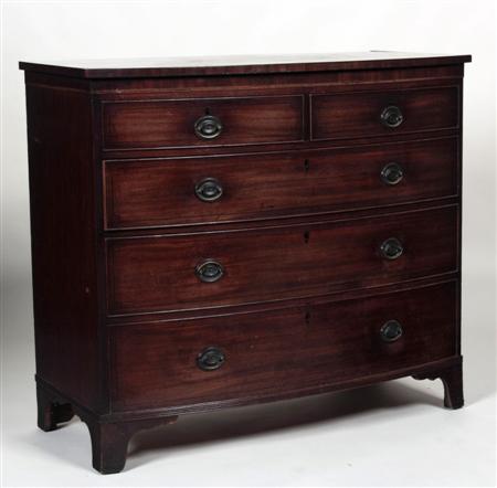 Appraisal: A George III mahogany bowfront chest the crossbanded top above