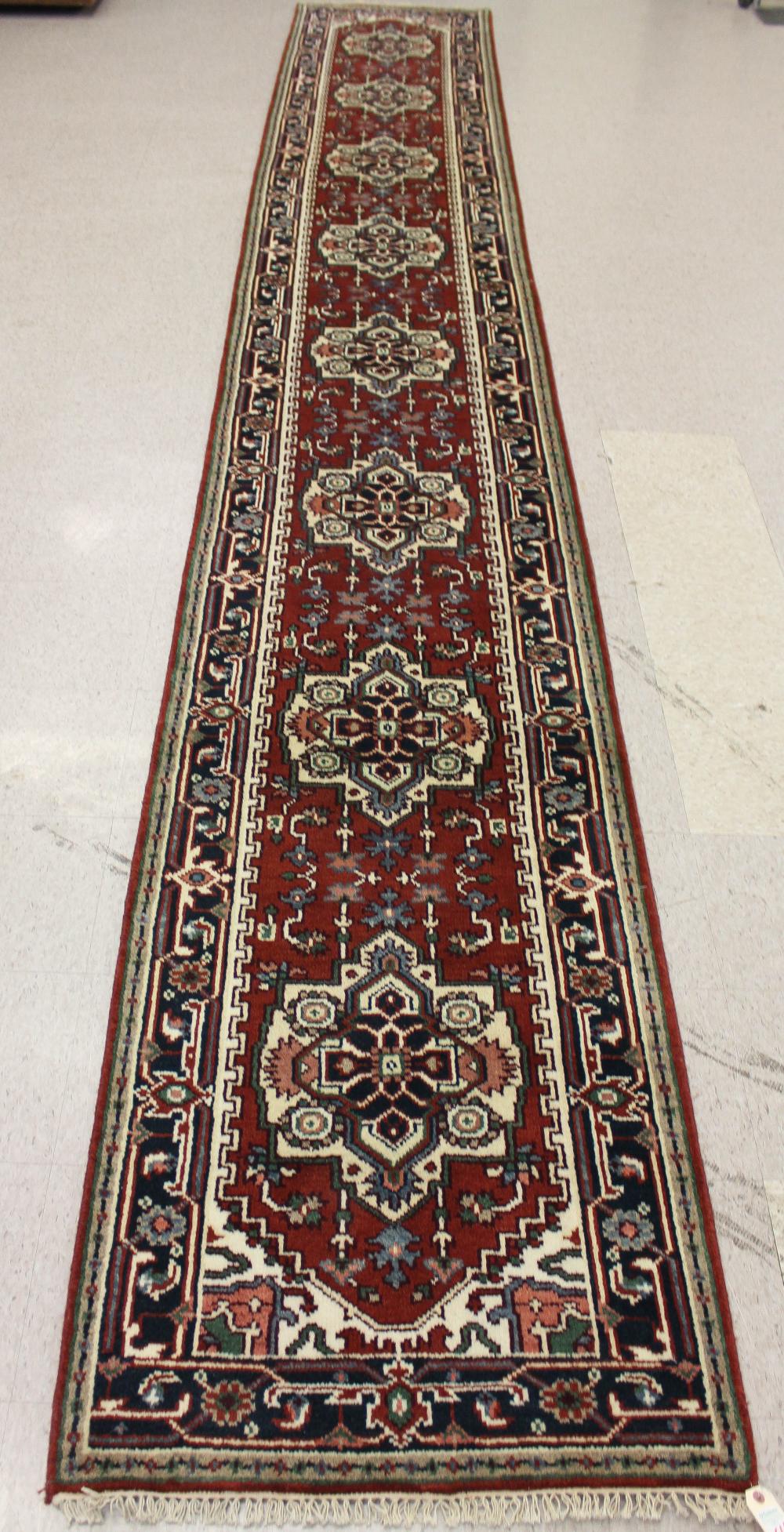 Appraisal: HAND KNOTTED ORIENTAL CORRIDOR RUG Persian Serab design featuring eight