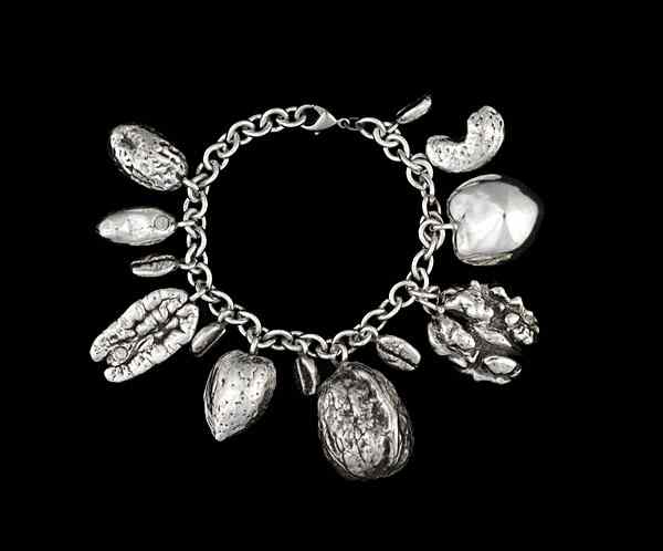 Appraisal: Sterling Silver Nut Charm Bracelet Sterling silver charm bracelet containing