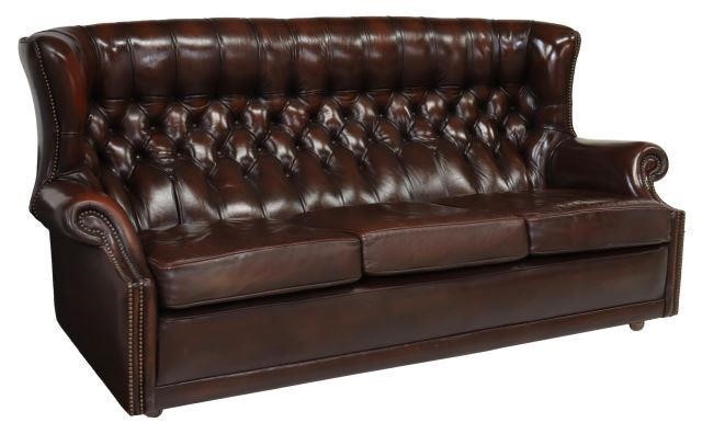 Appraisal: English wingback three-seat sofa late th c in brown leather