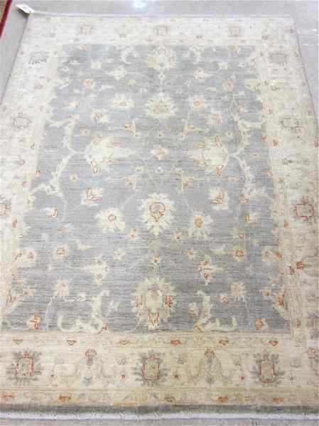 Appraisal: HAND KNOTTED ORIENTAL AREA RUG Pakistani-Persian floral design on gray