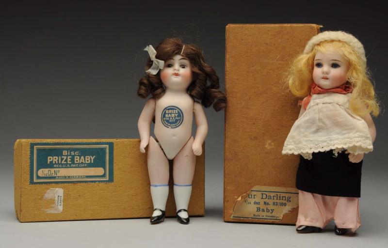 Appraisal: Lot Of Boxed All-Bisque Dolls Both German Prize Baby with